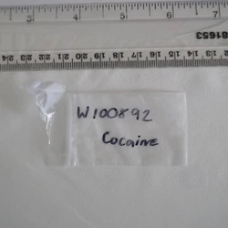 White Cocaine pill — Cocaine; Phenacetin — Newham (E16), England