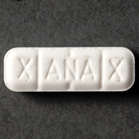 White rectangular alprazolam bars with score lines and imprinted markings