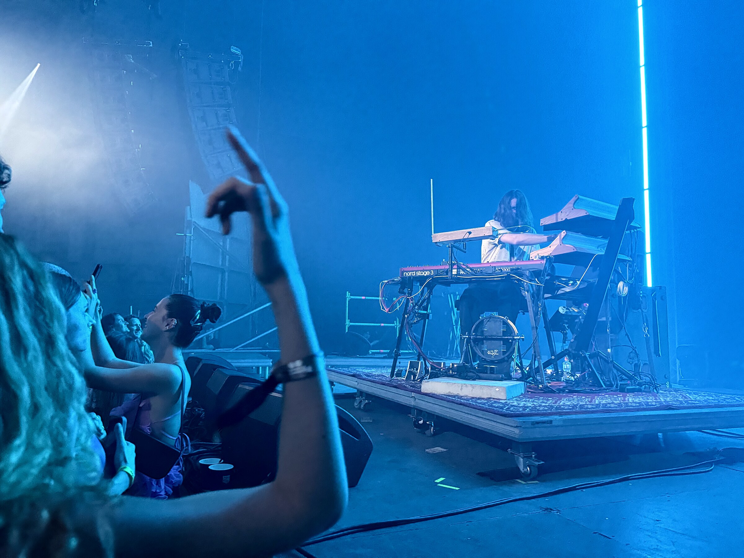 Mezerg performing live in blue stage light
