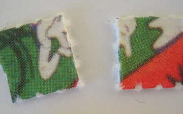 Two squares of printed LSD blotter paper photographed close up