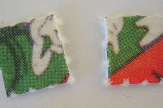 Two squares of printed LSD blotter paper photographed close up