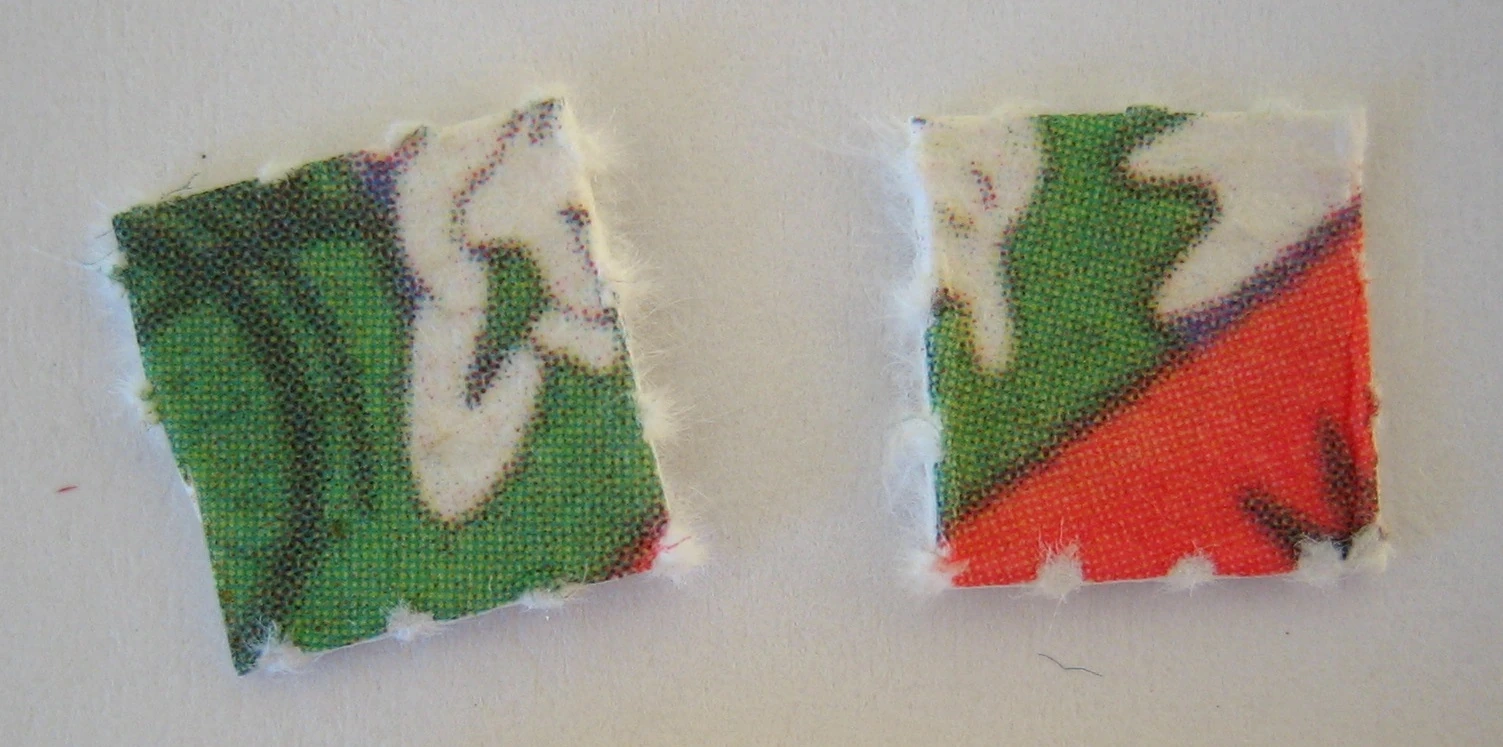 Two squares of printed LSD blotter paper photographed close up