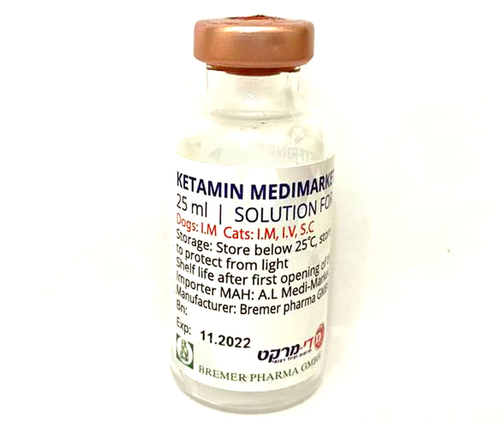 A small glass vial of veterinary ketamine solution labelled for dogs and cats