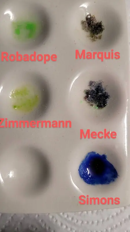 A coloured pressed pill tested with Robadope, Marquis, Mecke, Simon's and Zimmermann